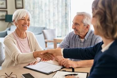 Woman shaking hands with real estate agent